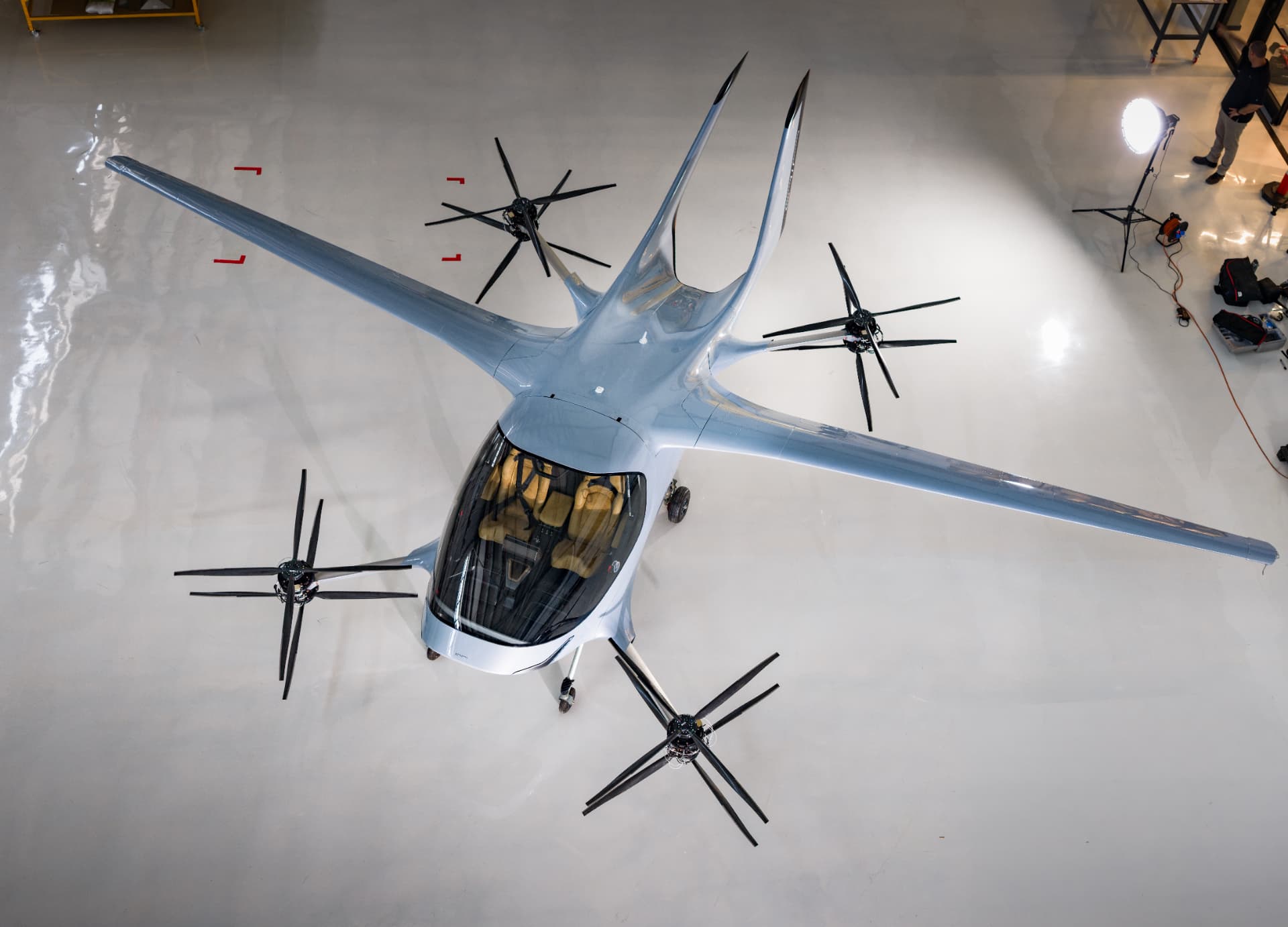 AIR eVTOL aircraft photographed from above inside a hangar