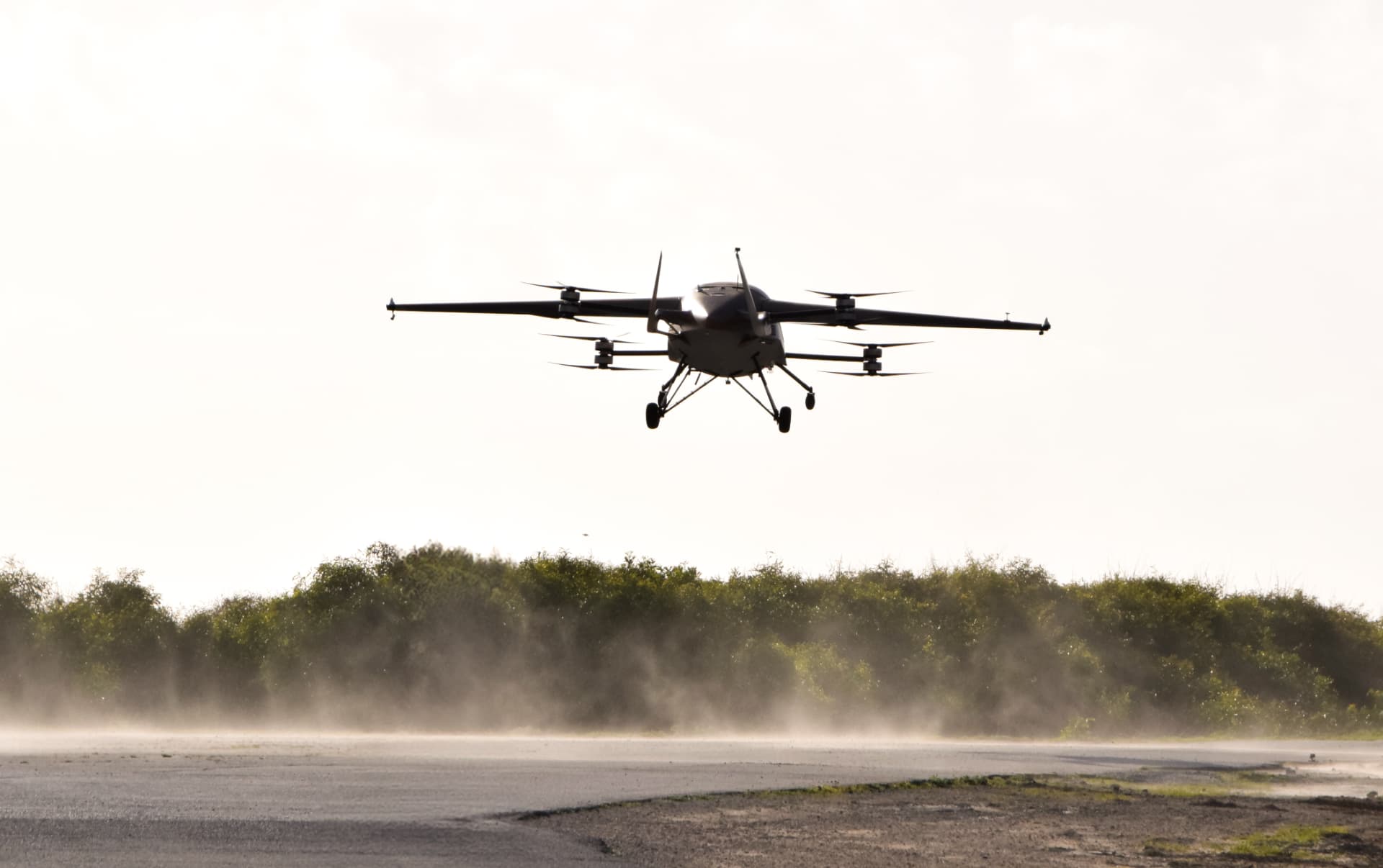 AIR cargo aircraft hovering above a runway